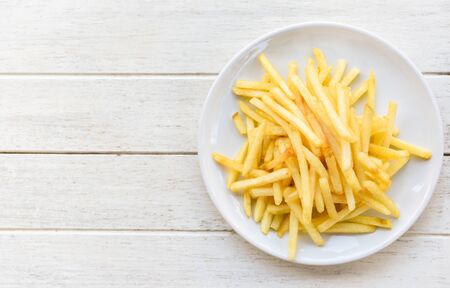 Tasty potato fries for food or snack / Fresh french fries on white plate delicious Italian meny...