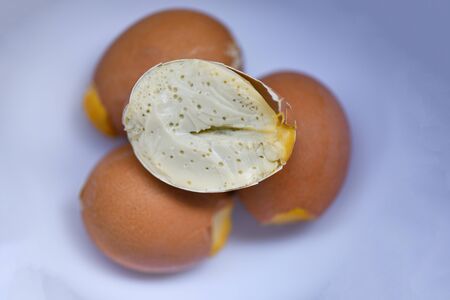 Steamed eggs on egg shells on plate / Seasoning egg for grilled with skewered , Thai street food