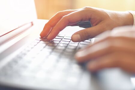 Male hand typing on keyboard concept / Businessman working on keyboard computer laptop man sitting...