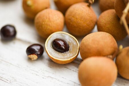 Fresh longan tropical fruit in Thailand / Close up dimocarpus longan peel and seed exotic fruits on...