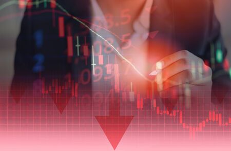 Businessman trading stocks market financial depressed / Crisis stock market graph chart down trend red price drop arrow down chart fall investment loss crash business crisis economyの写真素材