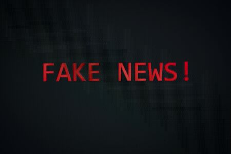 FAKE NEWS message on display screen black background technology alert computer or Mobile phone...