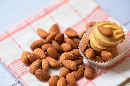 Almonds nuts on table cloths background / almond cookie for breakfast health foodの写真素材