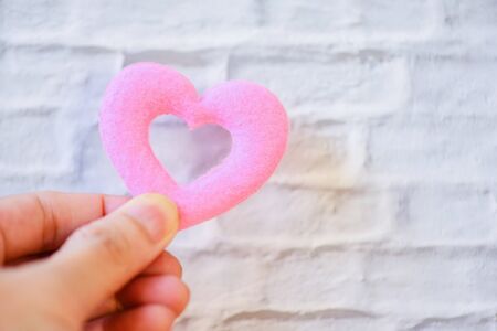 hands holding heart give love philanthropy donate help warmth take care valentines day / health care...