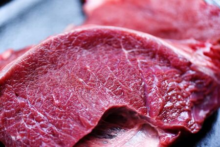 Close up of details raw beef meat texture background / Fresh beef sliced animal proteinの写真素材