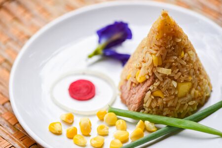fried rice corn on white plate asian food in thai 