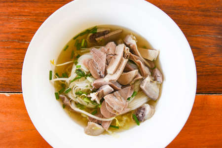 delicious noodles bowl / close up of vermicelli noodles soup with pork stew and vegetable in bowl...