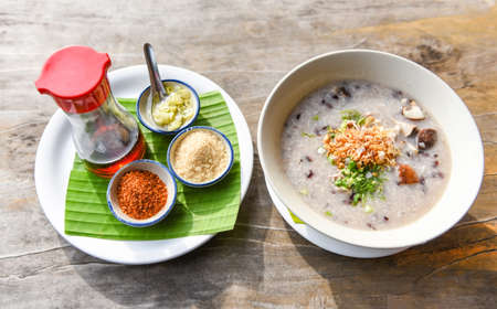 Mush or rice porridge / Boiled rice with pork shiitake mushrooms and vegetables with seasoning food...