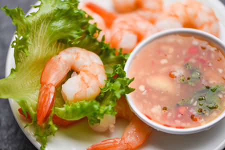 Shrimp delicious seasoning spices on white plate / appetizing cooked boiled shrimps prawns , salad shelfish seafood sauceの写真素材