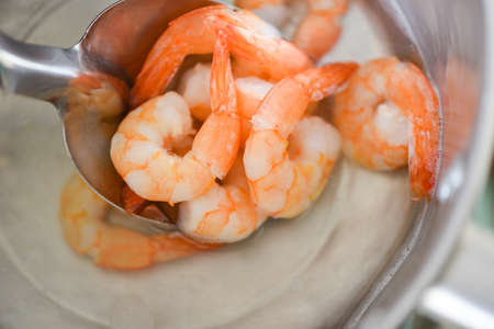 Boiled shrimps prawns on hot pot for cooking seafoodの写真素材