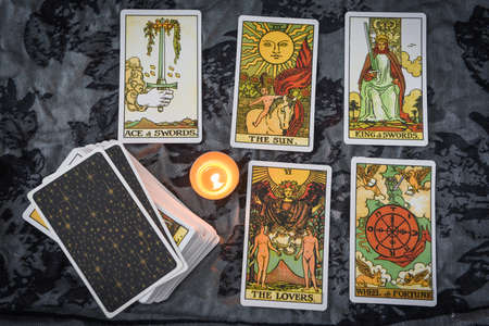 Tarot cards by candlelight on dark background fortune card prophecy, gypsy card for fortune teller reading future : Bangkok Thailand October 30 , 2020のeditorial素材