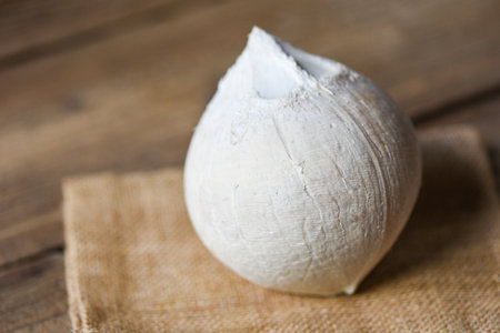 Tropical fruit coconut on wooden table, Fresh coconut for foodの写真素材
