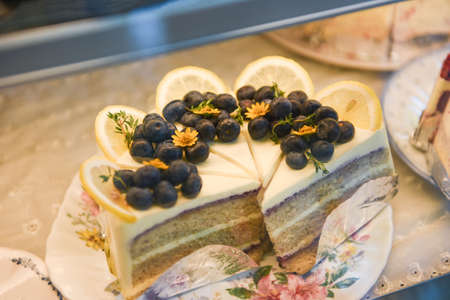 Cake on shelf with cake blueberry and lemon on store bakery shopの写真素材