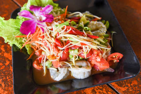 Green papaya salad with shrimp prawn Thai food, spicy salad herbsの写真素材