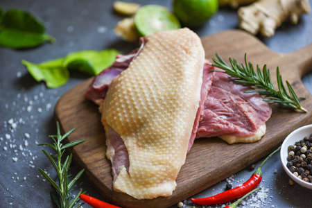 Fresh duck meat for food, Raw duck breast with herb spices ready to cookの写真素材