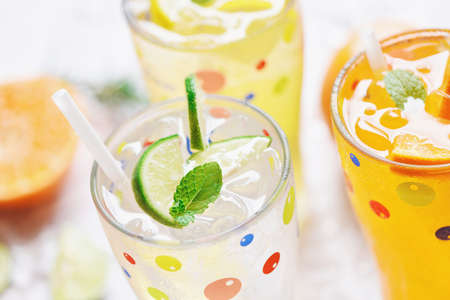 Exotic summer drinks refreshing variety of cold drinks glasses fresh fruit on ice homemade cocktail...
