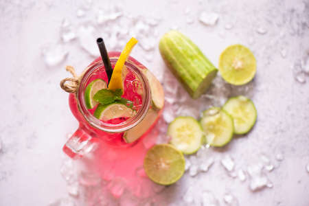 Exotic summer drinks refreshing of cold drinks glasses jar fresh fruit and vegetable on ice homemade...