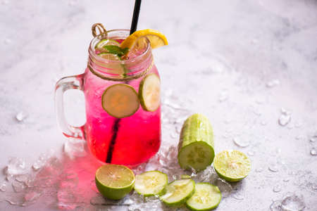 Exotic summer drinks refreshing of cold drinks glasses jar fresh fruit and vegetable on ice homemade...