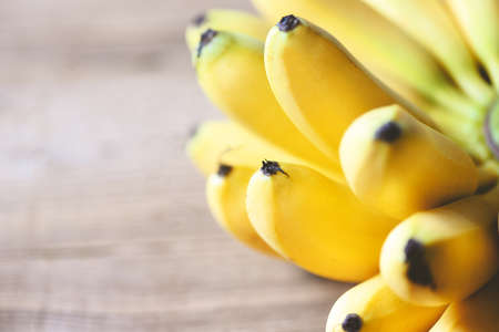 Banana tropical fruit on wooden background, fresh ripe bananaの写真素材