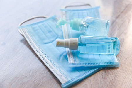 Face mask and product clean disinfectant kill virus bacteria germs hand sanitizer bottle gel for washing hands hygiene with alcohol gel and antibacterial soap sanitizer coronavirus prevention outbreakの写真素材
