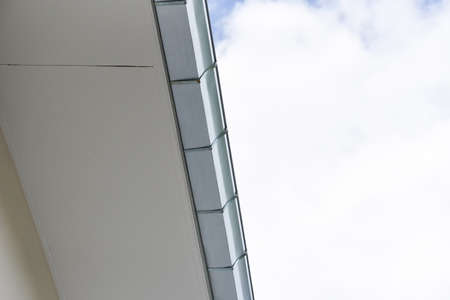 Rain gutter, Stainless steel aluzinc rain gutter on the roof house with sky background