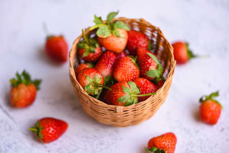Fresh strawberries on basket, Red ripe strawberry on the table backgroundの写真素材