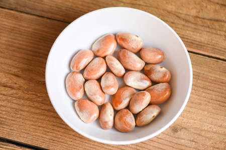 jackfruit seed on white bowl on a wooden background from ripe jackfruit fruitの写真素材