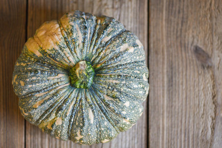 fresh Asian Thai pumpkin frome the garden for cooked food or dessert, green pumpkin food on wooden backgroundの写真素材