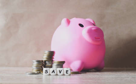 Save money concept, stack coins and save block word Save money for investment or education study...