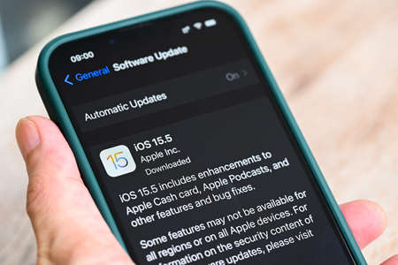 iPhone 13 Pro with iOS 15.5 logo on the screen close up, new operating system 2022 on iPhone apple devices sub version ios 15 for download updates : Bangkok, Thailand - May 29 2022のeditorial素材