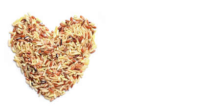 heart rice , brown rice on white background , various color mixed thai rice for cooking food , Loonzain rice brown black red white purple health food background.の写真素材