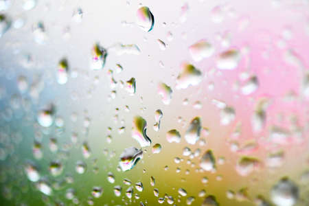 water drop glass background , nature water drop after rain , raindrops on glass window in the rainy seasonの写真素材