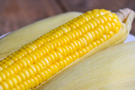 ripe corn cobs steamed or boiled sweetcorn for food vegan dinner or snack, cooked sweet corn...