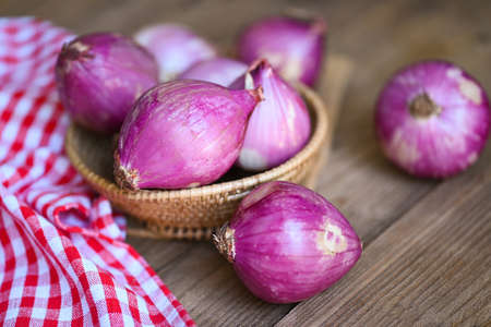 Shallots or red onion, purple shallots on basket , fresh shallot for medicinal products or herbs and spices Thai food made from this raw shallotの写真素材