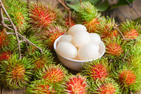 Fresh and ripe rambutan sweet tropical fruit peeled rambutan with leaf, Rambutan fruit harvest from the garden rambutan treeの写真素材