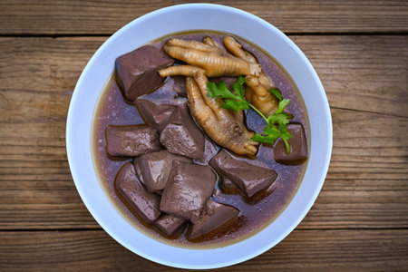 chicken blood, Thai food chicken feet soup stewed, cooking chicken feet foot stew on white with...