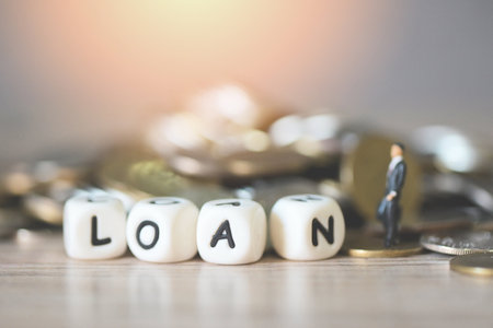 Loan business economy concept of money and finance, on table, Loan business finance economy and business man standing on a coin on wooden table backgroundの写真素材