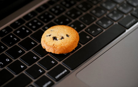 internet cookies internet browser cookies concept, mini cookies on keyboard computer laptop