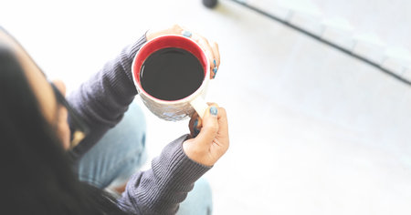 Morning relaxation girl sitting and enjoying coffee leisure time happy woman relaxing in home on...