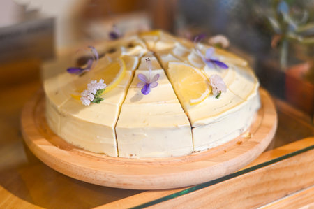 carrot cake on wooden plate, carrot cake with lemon for dessert and tea - fresh homemade carrot cake cake slice  in bakery cake shopの写真素材