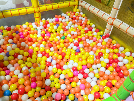 Children playground indoor at amusement park with colorful balls for playing, Inside the beautiful kids playground ball colored plastic of game roomの写真素材
