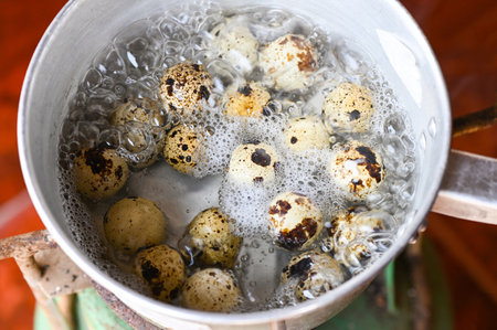 quail eggs , boiled eggs food in a hot pot on the stove, egg cooking healthy eating concept, eggs menu foodの写真素材