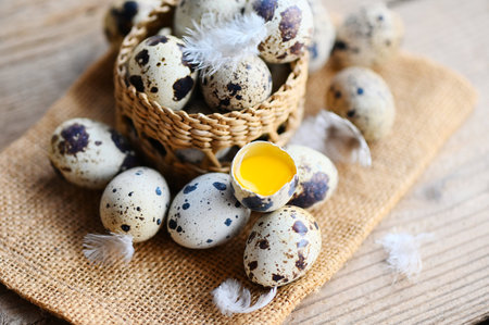 quail eggs on basket, fresh quail eggs on wooden table background, raw eggs with peel egg shellの写真素材
