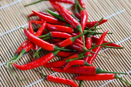 Chili pepper, Red hot chilli peppers on wooden background. Close up group of ripe red chilli - top viewの写真素材