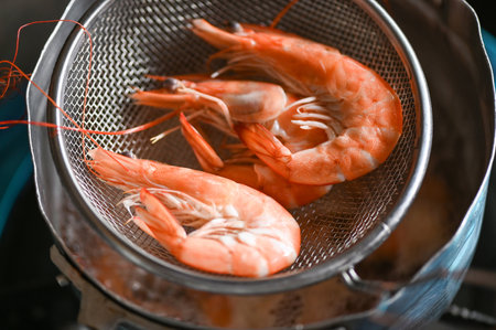 cooking food shrimp on hot pot, Fresh shrimps prawns seafood with boiled shrimp for cookedの写真素材