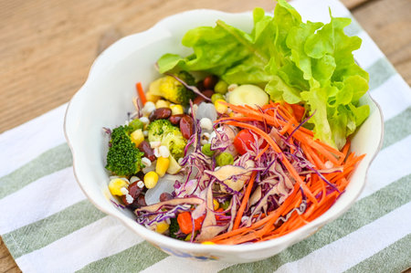 Thai food vegetable salads on salads bowl with fresh vegetable fruit nuts and grains for healthy food mixed vegetable salad vegetarian green and colorful food for breakfast - top viewの写真素材