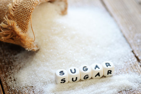 white sugar for food and sweets dessert candy heap of sweet sugar crystalline granulated, Sugar on sack and wooden backgroundの写真素材