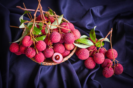 lychees on table and black background, fresh ripe lychee fruit tropical fruit peeled lychees slice in Thailand - top viewの写真素材