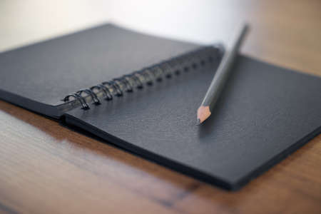 Pen and notepad on the tableの写真素材