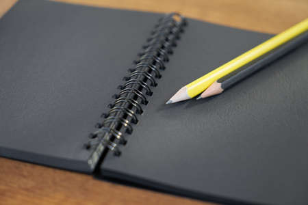 Pen and notepad on the tableの写真素材